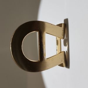 Vintage Etienne Aigner 1" gold tone belt buckle.
